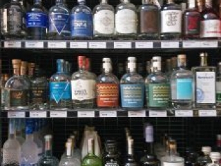 well stocked gin shelves in Tasmanian bottle shop