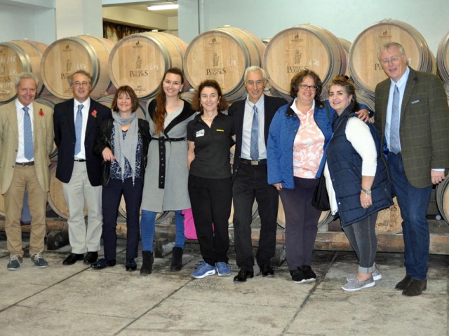 CRG team with guide Eva Figueira in cellar at Adega de Pegoes