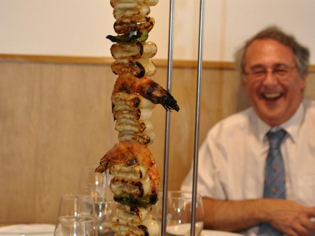 Nick surveys a cuttlefish skewer during a monumental lunch at Pegoes, Portugal