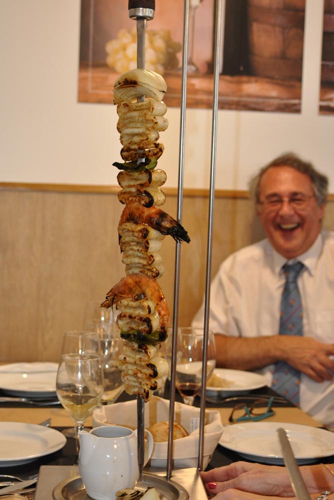 Nick surveys a cuttlefish skewer during a monumental lunch at Pegoes, Portugal